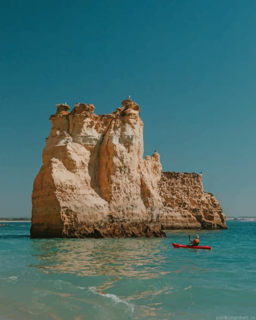 The Kayak And The Rock Seascapes Painting By Numberss.png